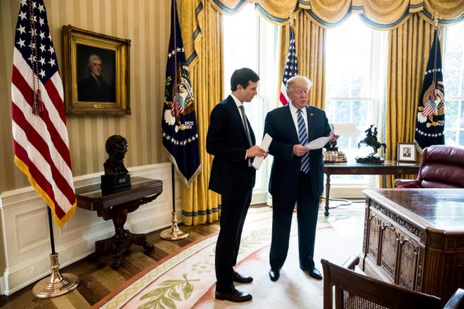 President Donald Trump speaks to White House Senior Adviser Jared Kushner, left, in the Oval Office in Washington, Friday, April 21, 2017. With his tweets and his bravado, Trump is putting his mark on the presidency in his first 100 days in office. He's flouted conventions of the institution by holding on to his business, hiring family members as advisers and refusing to release his tax returns. He's tested conventional political wisdom by eschewing travel, church, transparency, discipline, consistency and decorum. But the presidency is also having an impact on Trump, prompting him, at times, to play the role of traditional president. (AP Photo/Andrew Harnik)