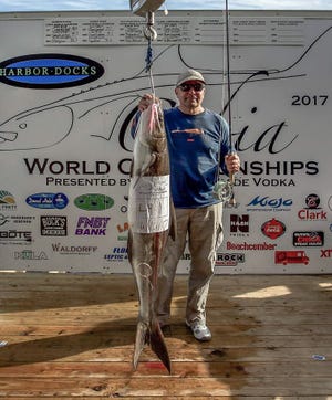 Harri Hotti shows off his cobia he caught while fly fishing aboard the Full Pull with Capts. Chris Wagner and Andy Block. His catch is still holding on the Cobia World Championship leader board. [SPECIAL TO THE LOG]