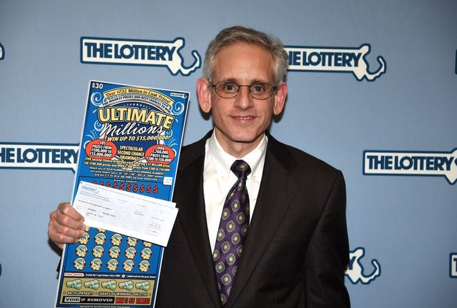 Canton attorney David Wolicki collected the prize from a $15 million winning lottery ticket sold in Brockton on behalf of the lottery winner, on April 12, 2017.