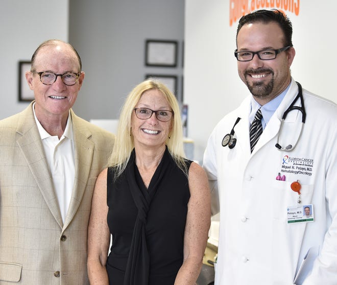 Dave and Bobbi Norris, with Dr. Miguel Pelayo. Thanks to the Norrises, patients undergoing chemotherapy at Lakewood Ranch's office of Florida Cancer Specialists now have warm blankets to comfort them. [HERALD-TRIBUNE STAFF PHOTO / THOMAS BENDER]