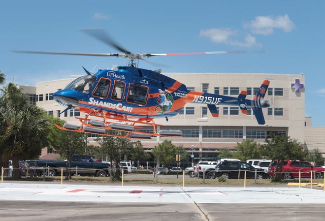 A ShandsCair helicopter ambulance lands Tuesday at Bay Medical Sacred Heart. [PATTI BLAKE/THE NEWS HERALD]