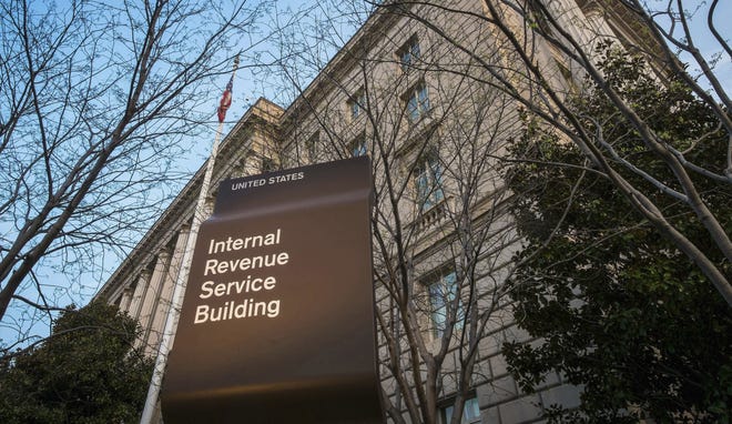 This April 13, 2014, file photo shows the Internal Revenue Service (IRS) headquarters building in Washington. President Donald Trump's plan to provide massive tax breaks to corporations faces big challenges as Washington struggles with mounting debt and the populist president tries to make good on promises to bring jobs and prosperity to the middle class. THE ASSOCIATED PRESS