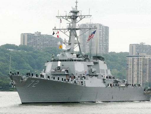 In this 2004 file photo, the USS Mahan, a guided-missile destroyer, moves up the Hudson River in New York during Fleet Week. A U.S. Navy guided-missile destroyer fired a warning flare toward an Iranian Revolutionary Guard vessel coming near it in the Persian Gulf, an American official said Wednesday, the latest tense naval encounter between the two countries.