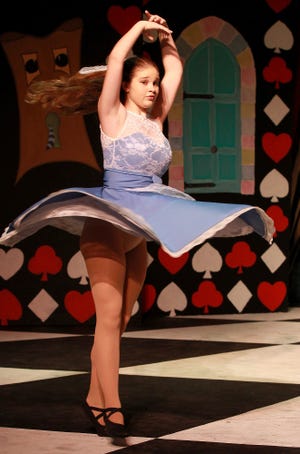 Torrie Epstein (Alice), dances during rehearsal for Gaston Dance Theatre's production of "Alice's Adventures in Wonderland" [JOHN CLARK/THE GASTON GAZETTE]