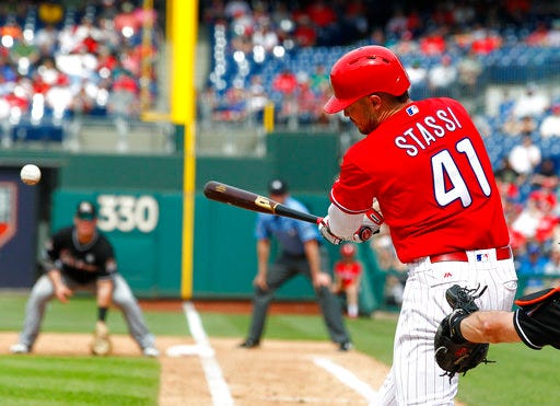 Philadelphia Phillies' Brock Stassi connects for an RBI double scoring Michael Saunders during the sixth inning of a baseball game against the Miami Marlins, Thursday, April 27, 2017, in Philadelphia. (AP Photo/Tom Mihalek)