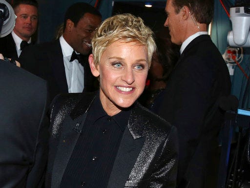 FILE - In this March 2, 2014 file photo, Ellen DeGeneres appears backstage during the Oscars in Los Angeles. DeGeneres made history 20 years ago as the first prime-time lead on network TV to come out, capturing the hearts of supporters gay and straight amid a swirl of hate mail, death threats and, ultimately, dark times on and off the screen. (Photo by Matt Sayles/Invision/AP, File)