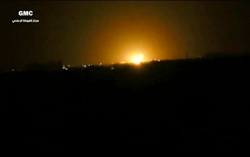 This frame grab from video provided by the Syrian anti-government activist group Ghouta Media Center, which has been authenticated based on its contents and other AP reporting, shows flames rising after an explosion near an airport west of Damascus, Syria, Thursday, April 27, 2017. Syria's state media reported Thursday that Israel has attacked a military installation near the Damascus International Airport. SANA says Israel fired several missiles from inside the occupied Golan Heights south of the capital at a military installation near the capital's main airport, triggering several explosions and causing damage. (Ghouta Media Center via AP)