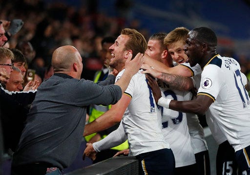 Tottenham players celebrate with their fans after Tottenham's Christian Eriksen scored a goal during the English Premier League soccer match between Crystal Palace and Tottenham Hotspur at Selhurst Park stadium in London, Wednesday, April 26, 2017. (AP Photo/Kirsty Wigglesworth)