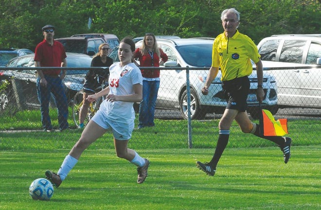 In this Daily Times file photo, Pekin's Tyranie Cox makes a drive down the field earlier this season. Cox scored two first-half goals in the Pekin girls soccer 5-0 victory over Washington Wednesday. TIMES FILE PHOTO