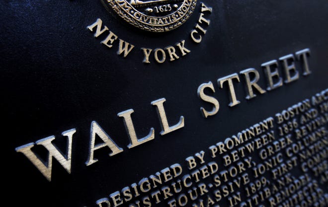 This Jan. 4, 2010, file photo shows an historic marker on Wall Street in New York. THE ASSOCIATED PRESS