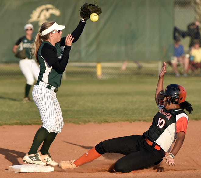 Sarasota's Sierra Vander Clay is safe at second base after Lakewood Ranch's Kinsey Goelz bobbles the ball during the Class 8A-District 8 softball championship game Thursday. [HERALD-TRIBUNE STAFF PHOTO / THOMAS BENDER]