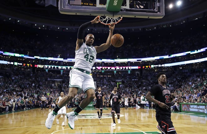 Boston Celtics center Al Horford slams a dunk against the Chicago Bulls during the fourth quarter of Game 4 in Boston on Wednesday. The Celtics defeated the Bulls 108-97 thanks to their best quarter of the series. [Charles Krupa/The Associated Press]