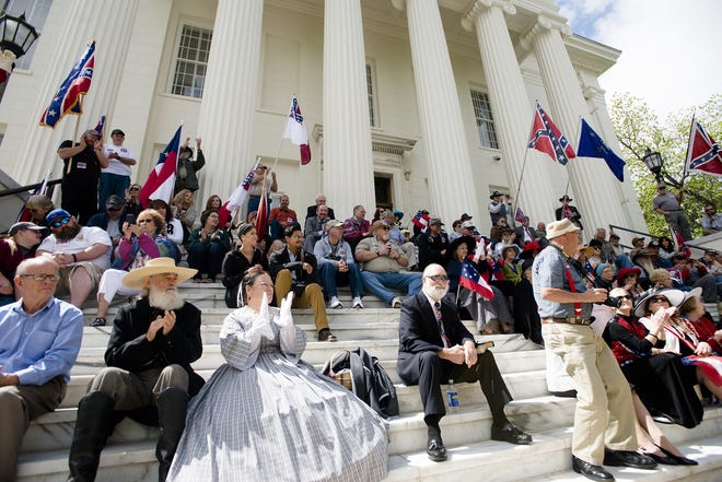 People applaud during a Confederate Memorial Day service outside the Alabama Capitol on Monday, April 24, 2017, in Montgomery, Ala. (Albert Cesare/The Montgomery Advertiser via AP)