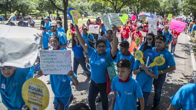 Supporters of the Texas Charter School Association and charter school students march on the Capitol grounds Wednesday, calling for facilities funding. RICARDO B. BRAZZIELL/AMERICAN-STATESMAN
