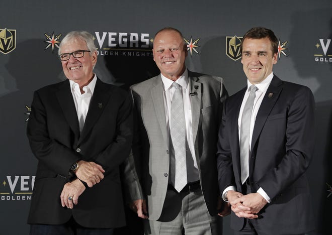 Vegas Golden Knights coach Gerard Gallant is flanked by Bill Foley, left, owner of the Vegas Golden Knights, and George McPhee, Vegas Golden Knights general manager, on April 13 in Las Vegas. [AP Photo / John Locher, File]