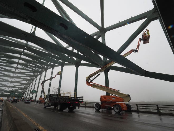 Bridge inspectors use high lifts in the breakdown lane of the Interstate 95 Piscataqua River Bridge for annual maintenance and the inspection of the bridge's truss members. The closed lanes will reopen Monday, May 1. [Rich Beauchesne/Seacoastonline]