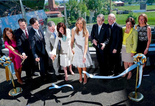First lady Melania Trump, center, participates in a ribbon cutting ceremony and grand opening of the Bunny Mellon Healing garden at Children's National Hospital in Washington, Friday, April 28, 2017. The garden is dedicated to the first ladies of the United States. (AP Photo/Pablo Martinez Monsivais)