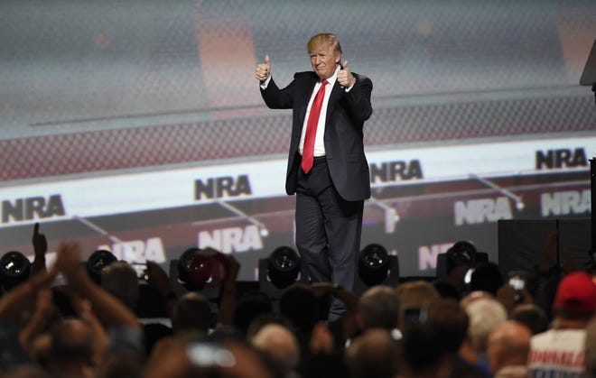 President Donald Trump gives the thumb’s up Friday after speaking at the National Rifle Association-ILA Leadership Forum in Atlanta. Saturday marks Trump’s 100th day in office. [MIKE STEWART/THE ASSOCIATED PRESS]