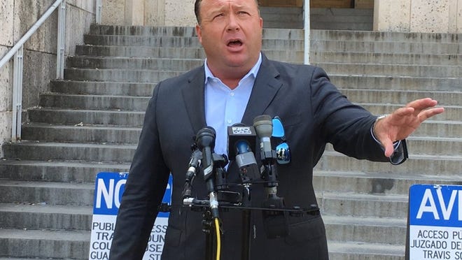 Alex Jones speaks Friday afternoon in front of the Heman Marion Sweatt Travis County Courthouse.