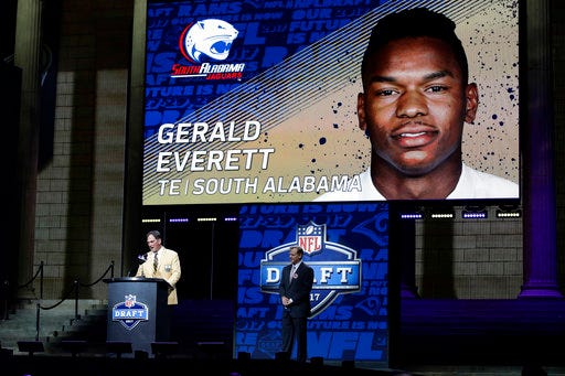 Former Los Angeles Rams player Jack Youngblood, left, announces South Alabama's Gerald Everett as the Rams' selection in the second round of the 2017 NFL football draft, Friday, April 28, 2017, in Philadelphia. (AP Photo/Matt Rourke)