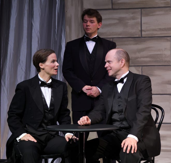 Eden Casteel as Victoria Grant, left, and Christopher Swan as King Marchand, right, become acquainted, while Ben Salus as bodyguard “Squash” Bernstein looks on in "Victor/Victoria," on stage at Ocean State Theatre in Warwick through May 21. [Mark Turek]