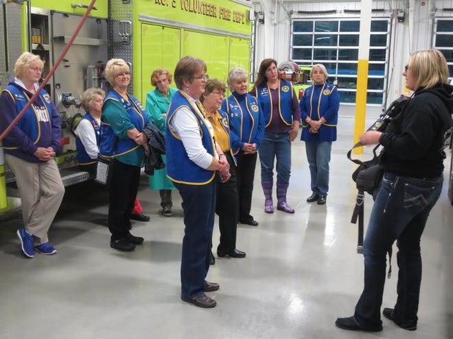 Sara Tongel, of the Volunteer Fire Department #3 in Grover, gives a tour of the firehouse to members of Shelby’s Auxiliary Unit 82 during National Volunteer Week. [Special to The Star]