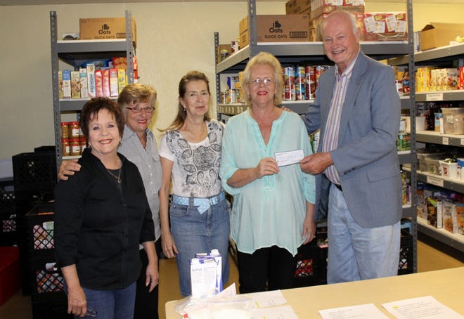 Members of the Unitarian Universalist Congregation of Lake County recently presented Lake Cares Food Pantry a $1,000 check. Pictured, from left to right, are Suzie Lockwood, trustee; Gina Rossi, public relations; Christine Higgins, president; Irene O’Malley, director of Lake Cares; and Stuart Anderson. [SUBMITTED]