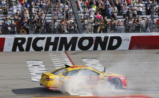 Joey Logano does a burnout after winning on Sunday at Richmond International Raceway in Richmond, Va. [Steve Helber/The Associated Press]
