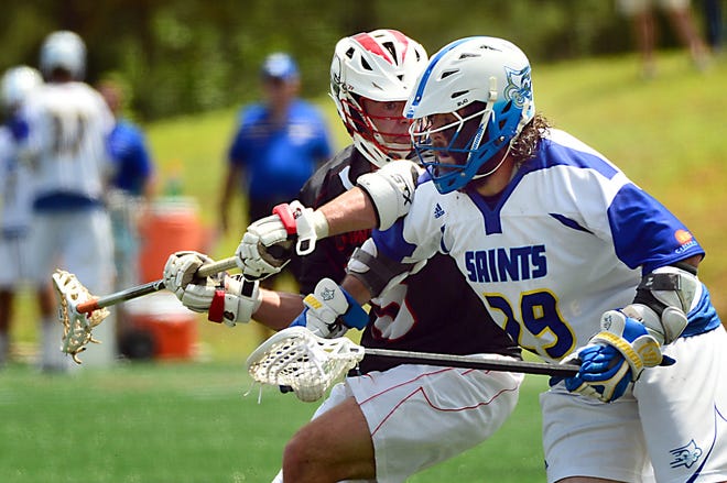Limestone's Brendan P. Smith (29), right, looks for an opening against Belmont Abbey on Sunday in Tigerville. Smith had three goals and an assist during the Saints' victory. [ALEX HICKS JR./SPARTANBURG HERALD-JOURNAL]