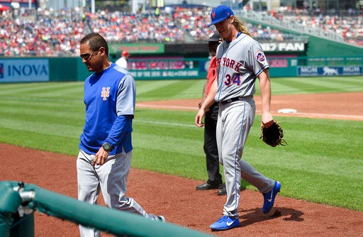 New York Mets starting pitcher Noah Syndergaard (34) leaves a baseball game with an injury during the second inning against the Washington Nationals, Sunday, April 30, 2017, in Washington. (AP Photo/Nick Wass)