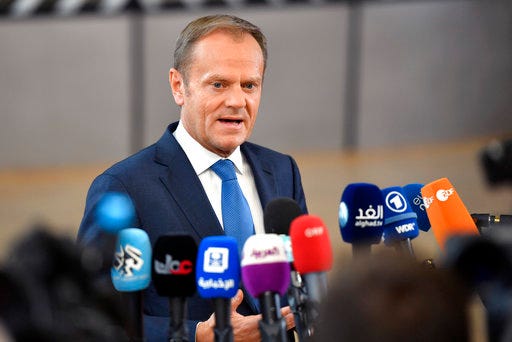 European Council President Donald Tusk speaks with the media as he arrives for an EU summit at the Europa building in Brussels on Saturday, April 29, 2017. EU Council President Donald Tusk says that Britain will face a united bloc of 27 EU nations in the two years of divorce negotiations and said the welfare of citizens and families living in each other's nations will be the priority once the talks start. (AP Photo/Martin Meissner)
