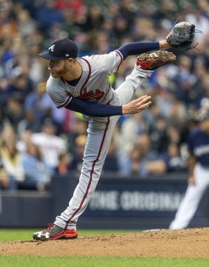 Atlanta Braves' Mike Foltynewicz pitches to a Milwaukee Brewers batter during the first inning of a baseball game Sunday in Milwaukee. [AP Photo/Tom Lynn]
