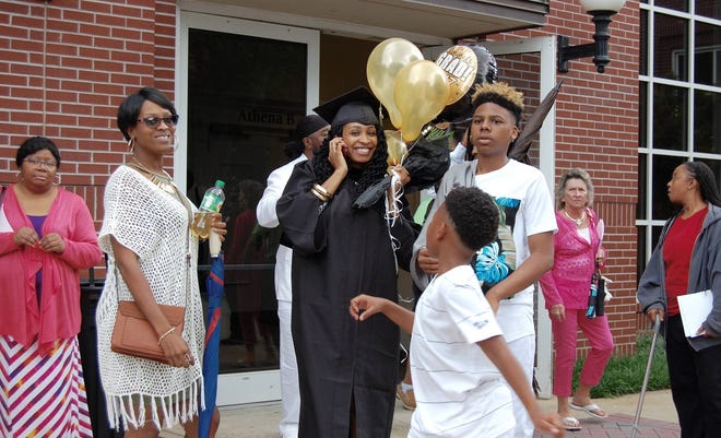 Graduates gathered with family and friends for congratulations and photos after Athens Technical College graduation exercises in the Classic Center Monday. (Photo / Lee Shearer/Staff)
