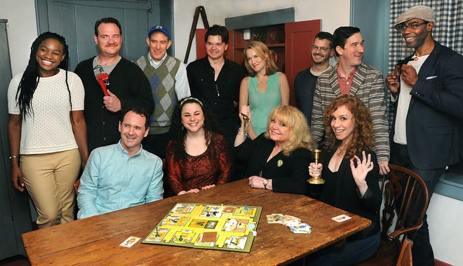The cast and crew of "Clue On stage": Standing (from left), Claire Simba, who plays Yvette; Kevin Carolan, who plays Col. Mustard; William Youmans who plays Mr. Body; Hunter Foster, director; Erin Dilly, who plays Mrs. White; Michael Holland, music composer; Carson Elrod, who plays Wadsworth; and Clifton Duncan, who plays Professor Plum. Seated, Brian J. Carter, who plays Mr. Green; Cassandra Dupler, who plays a variety of characters; Sally Struthers, who plays Mrs. Peacock; and Lindsay Nicole Chambers, who plays Miss Scarlet.
