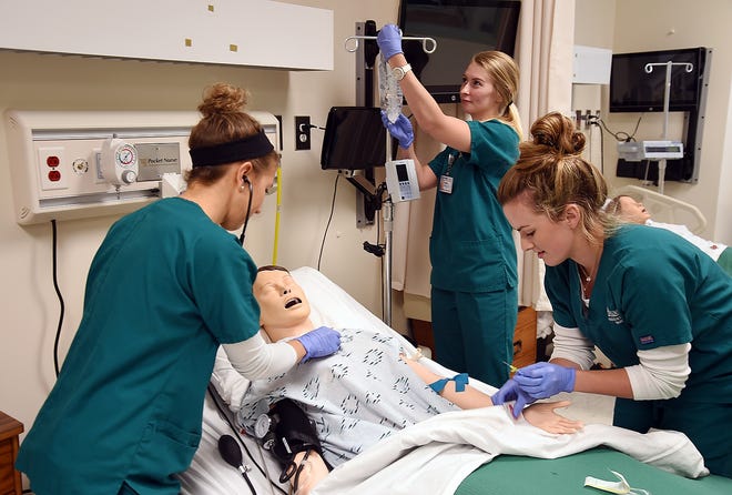 The nursing program at Brunswick Community College is currently located in building B on the Bolivia campus and, if funding is approved, that facility will be upgraded. Associate degree nursing students Lauren Jessup, Kaitlyn Hewett and Elliott Lowe work in simulation labs on campus as part of their regular curriculum. [Chip Ellis/StarNews]