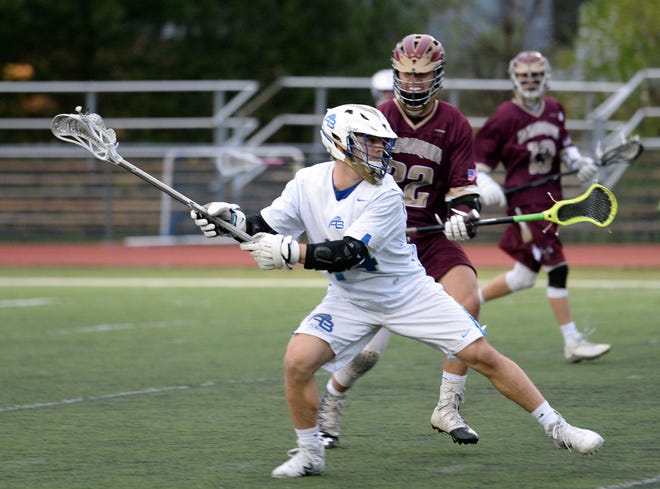 Acton-Boxborough senior captain Sam Witt winds up to fire off a shot on the Algonquin net, during the game at Leary Field in Acton, April 30, 2017. The Colonials beat the Tomahawks, 12-8. [Wicked Local Staff Photo/John Walker]