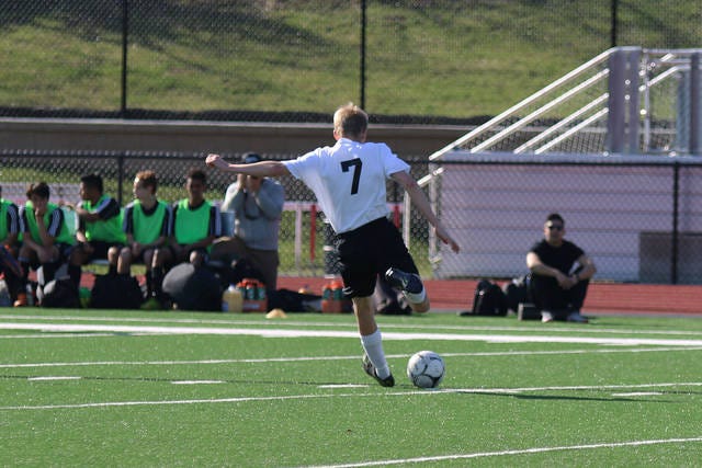 Lucas O’Connor passes the ball during a game earlier this season. O’Connor scored one of the goals during the game against Clear Creek Amana on April 29 during the Pella Tulip Time Tournament. PHOTO BY BAILEY FREESTONE/DALLAS COUNTY NEWS