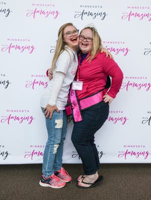 Mikayla Holmgren, the volunteer buddy, with Maggie Erickson, the participant of the Minnesota Miss Amazing Pageant, on April 1 at Hopkins Center for the Arts in Hopkins, Minn. [Minneapolis Star Tribune/TNS/Xavier Wang]