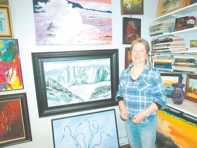 Eliane Ambrose is shown with a handful of the works in her studio, which she will open to the public for the first time this weekend. For video, visit echo-pilot.com.
