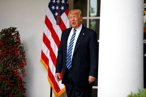 President Donald Trump talks with reporters as he walks to the Oval Office of the White House in Washington, Tuesday, May 2, 2017. President Donald Trump says the nation “needs a good `shutdown’ in September” to fix a “mess” in the Senate, saying on Twitter that the country needs to “either elect more Republican Senators in 2018 or change the rules now to 51 (percent),” suggesting more rules changes ahead in the Senate. (AP Photo/Evan Vucci)