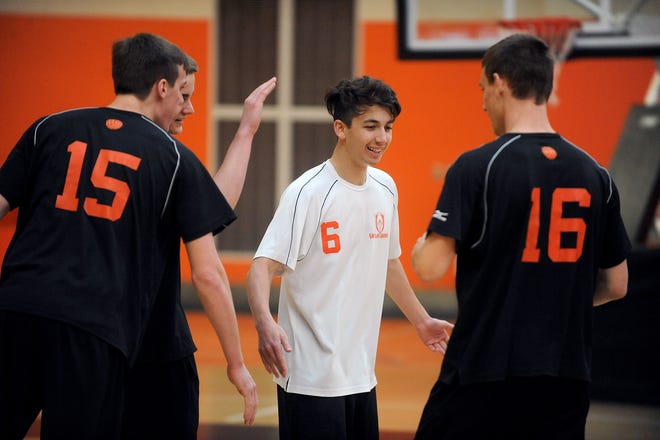 Wayland boys volleyball's John Gordon (left), Ryan Kim (center), and Jack Fletcher, pictured here earlier this season, led the Warriors to a playoff-clinching win over Acton-Boxboro on Tuesday. [Daily News and Wicked Local Staff Photo/Art Illman]
