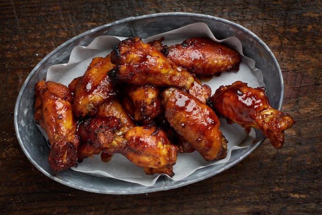 Irresistible Wings are a real potluck favorite. The recipe can be sized up to feed a crowd. [The Washington Post/Deb Lindsey]