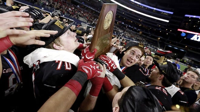 Lake Travis football players celebrate their victory over The Woodlands in the 2016 Class 6A, Division I final this past December. This year, the UIL will spread its 12 state-title games at AT&T Stadium over four days, opting to schedule four triple-headers. CREDIT: Stephen Spillman/For American-Statesman