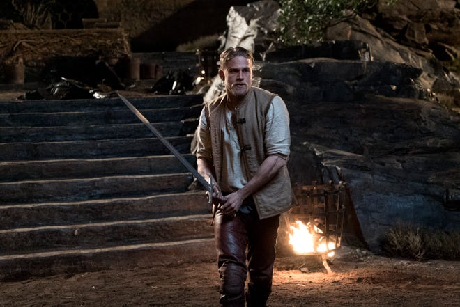 King Arthur (Charlie Hunnam) and his trusty Excalibur are ready to defend his kingdom. (Photo by Daniel Smith)