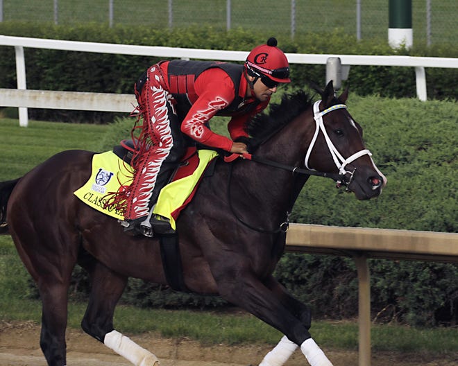 Exercise rider Martin Rivera gallops Kentucky Derby hopeful Classic Empire at Churchill Downs in Louisville, Ky. on Wednesday. [AP Photo/Garry Jones]