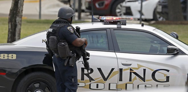 An officer works at a shooting scene on the North Lake College campus in Irving, Texas, Wednesday, May 3, 2017. The situation prompted a lockdown at the school in the Dallas suburb. THE ASSOCIATED PRESS