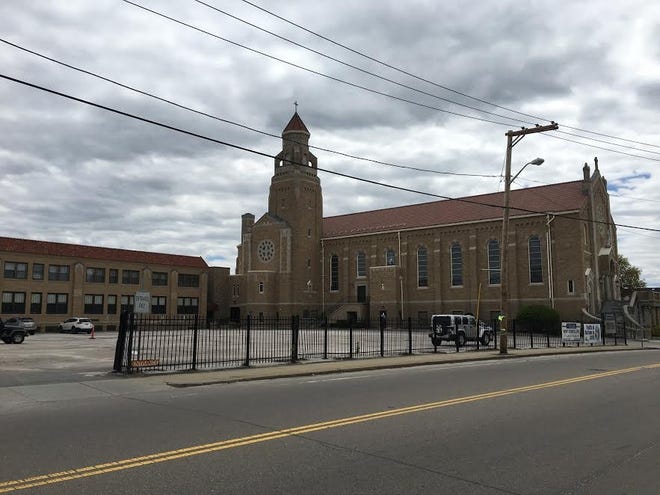 The Milford Catholic Elementary School, located in the building to the left of the Sacred Heart of Jesus Parish in Milford, may close at the end of the school year. (Daily News Photo/Zachary Comeau).