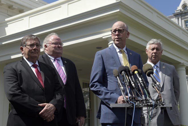 Rep. Greg Walden, R-Ore., second from right, speaks to reporters outside the White House in Washington, Wednesday, May 3, 2017, following a meeting with President Donald Trump on health care reform. From left are, Rep. Michael Burgess, R-Texas, Reps. Billy Long, R-Mo., and Rep. Fred Upton, R-Mich. THE ASSOCIATED PRESS