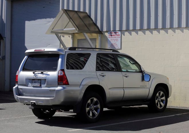 In this March 3, 2017, file, photo, the Toyota 4Runner held in a Boston Police evidence lot in the Hyde Park neighborhood of Boston is seen during a "view" of pertinent locations and evidence in the Aaron Hernandez trial.