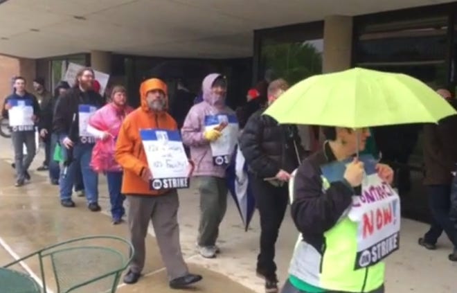 University of Illinois Springfield professors march and carry signs during the second day of picketing on campus on Wednesday, May 3, 2017. SJ-R.